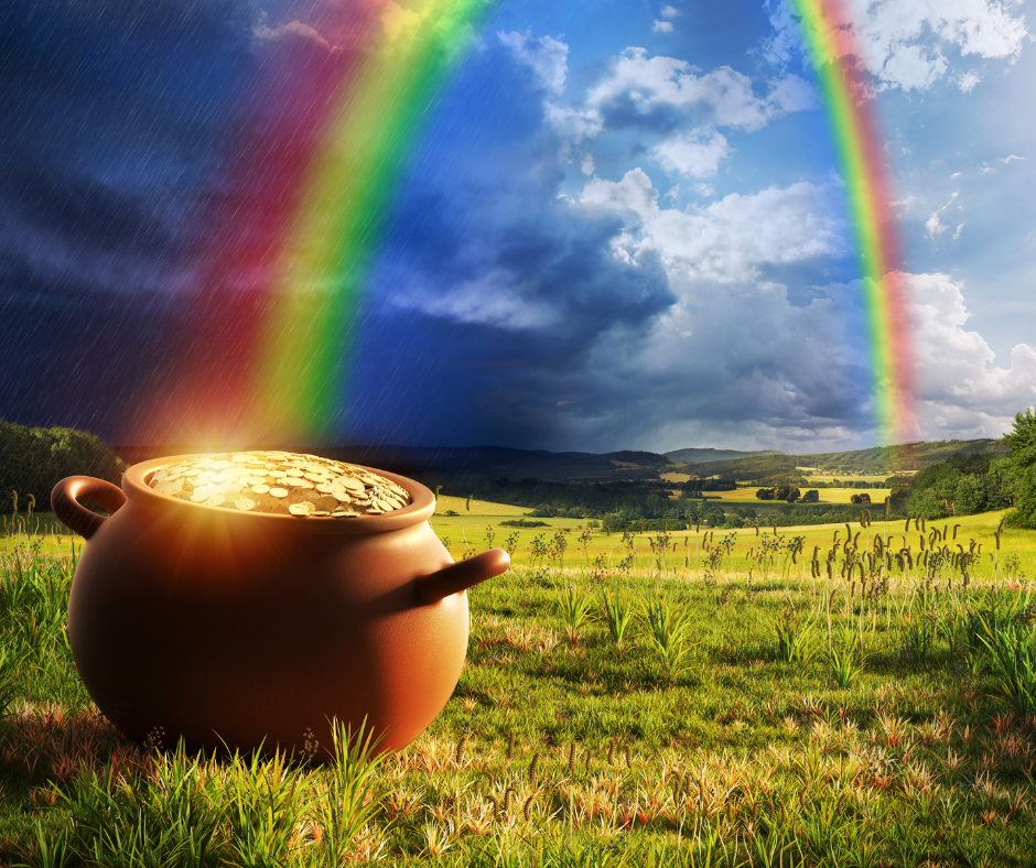 Pot of gold at rainbow's end in scenic meadow.