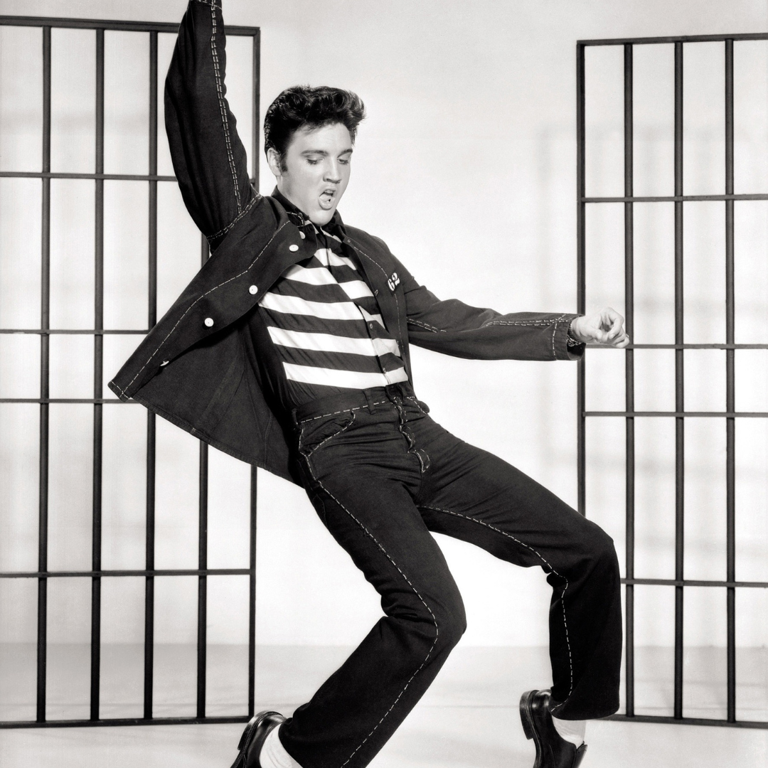 Man dancing in vintage black and white photo.