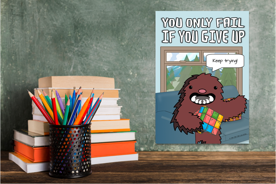Inspirational poster and colored pencils in classroom.