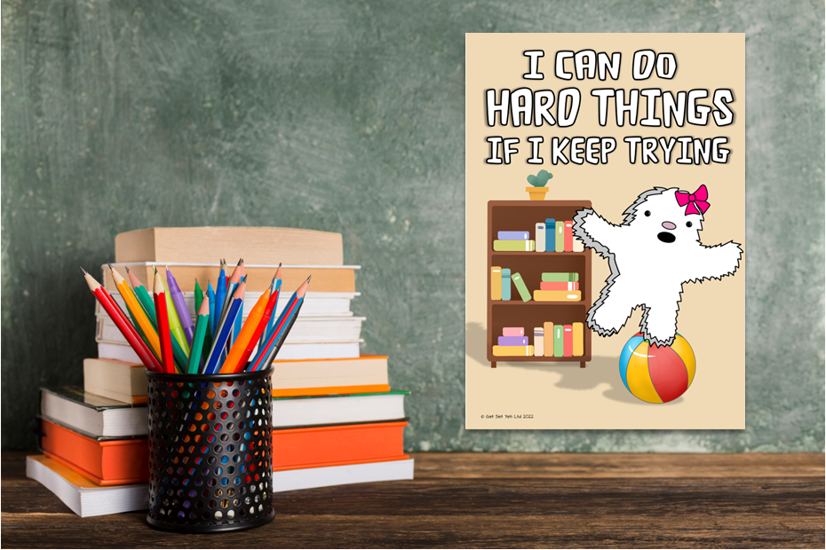 Inspirational poster with cartoon dog and books on desk.