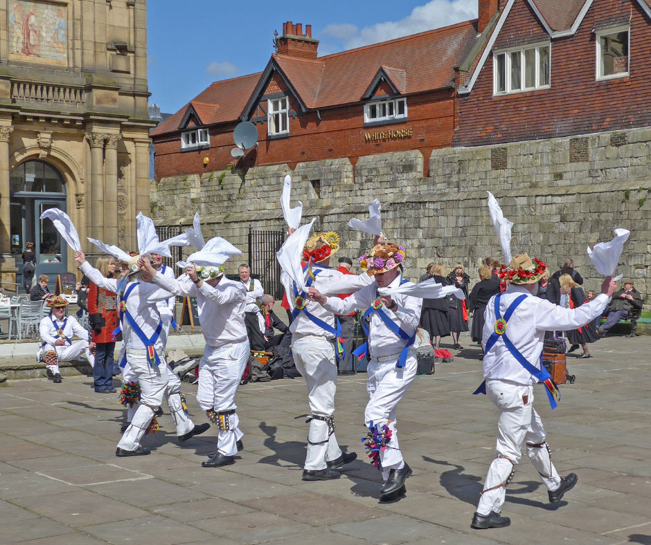 Morris dancers performing traditional dance in the UK.