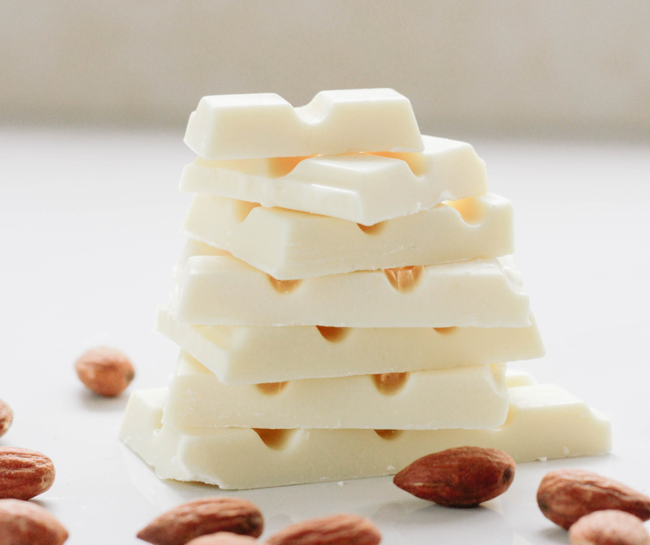 Stacked white chocolate with whole almonds.