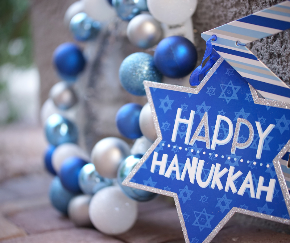 Blue and white Happy Hanukkah decoration with stars.