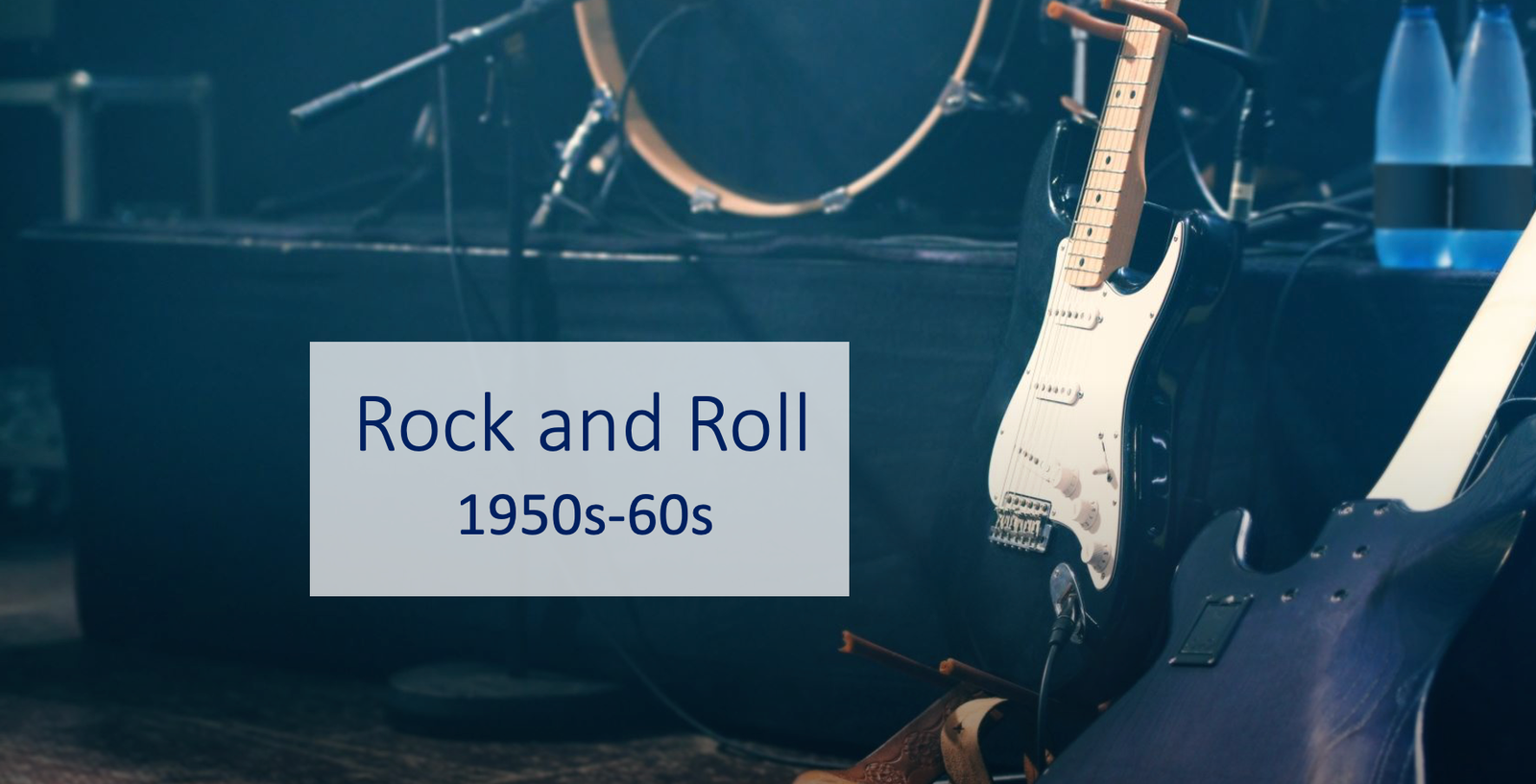 Vintage guitar and drums, Rock and Roll era stage.