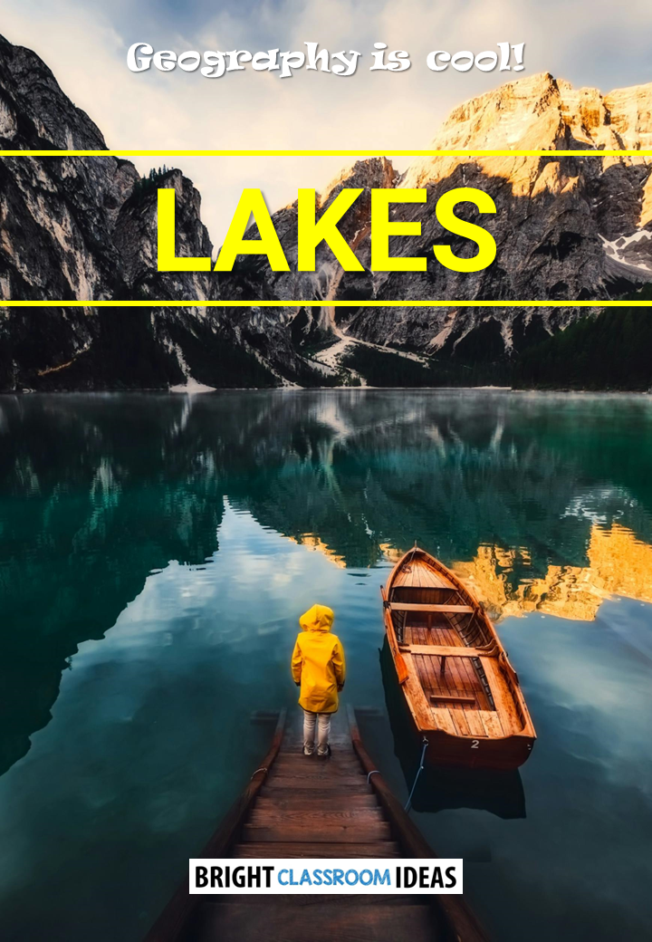 Person on dock overlooking mountain lake