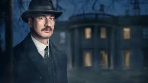 Man in suit and hat, night, mansion backdrop