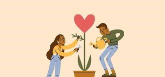 Two people tending heart-shaped plant in pot.