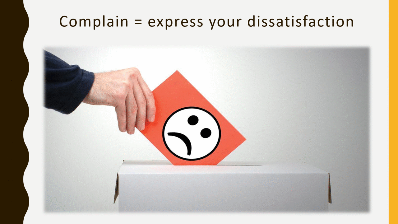 Hand inserting complaint card into box