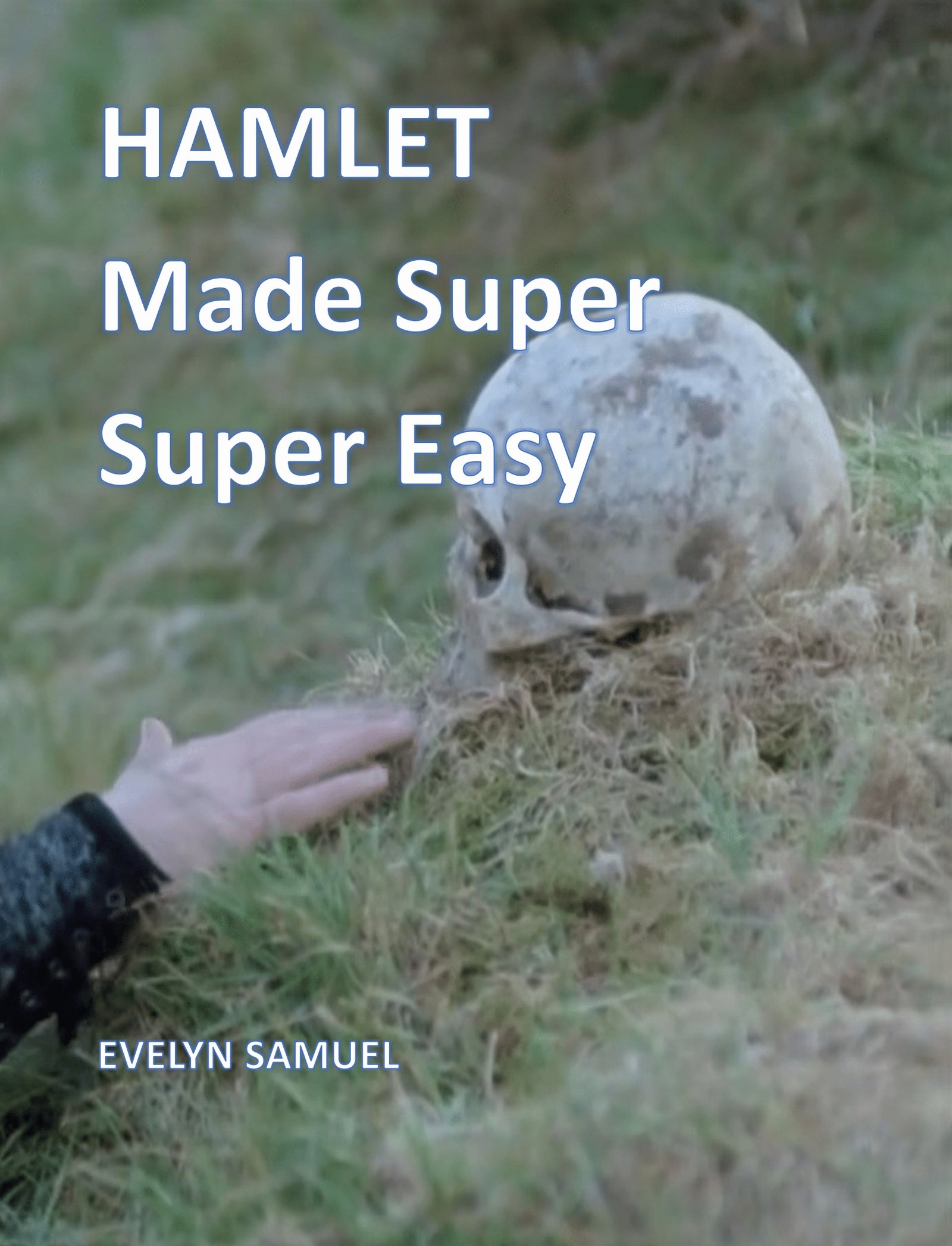 Skull on grass with Hamlet book title